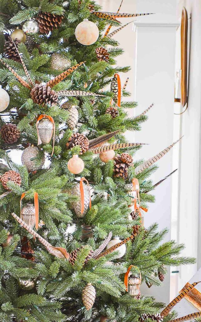 Christmas tree with pheasant feathers, pinecones, velvet ribbon