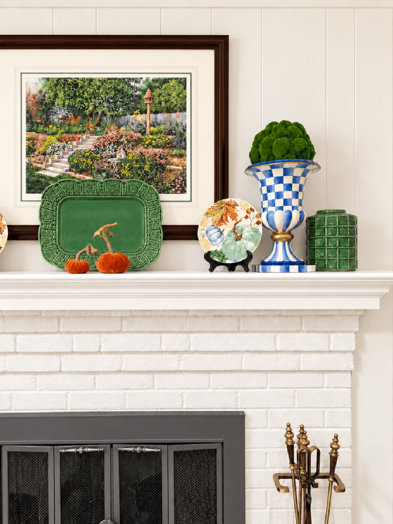 white fireplace with colorful decor