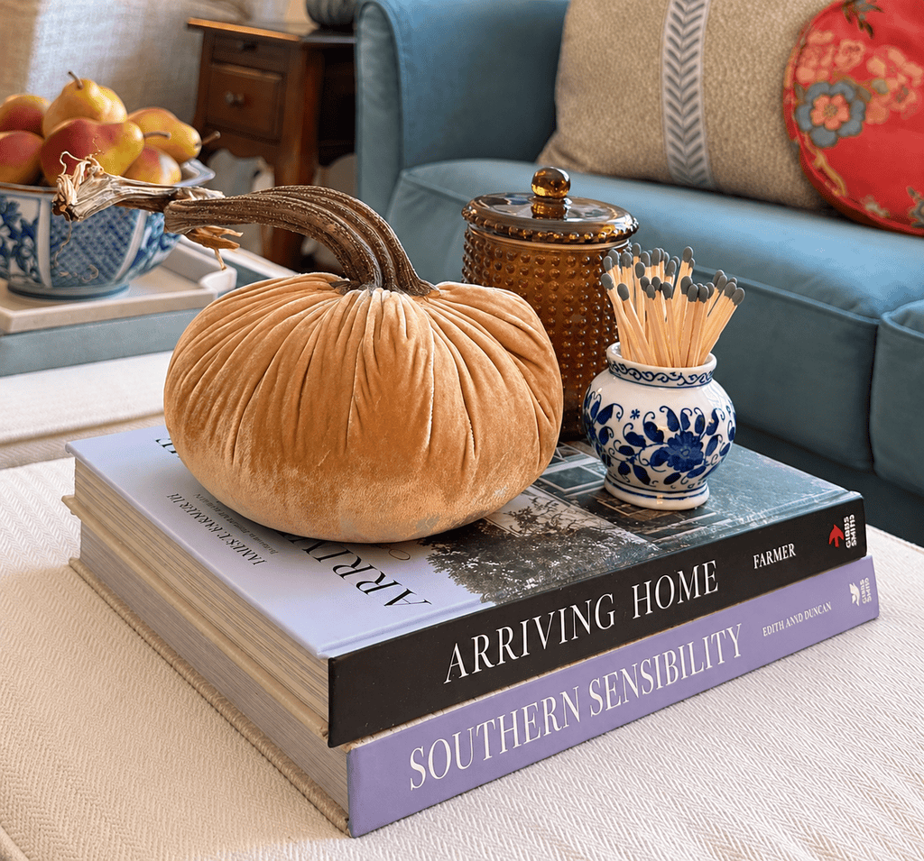 velvet pumpkin on a small stack of books